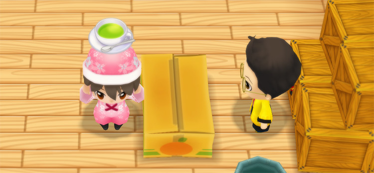 The farmer stands in front of Huang’s counter while holding a cup of Relax Tea. / Story of Seasons: Friends of Mineral Town